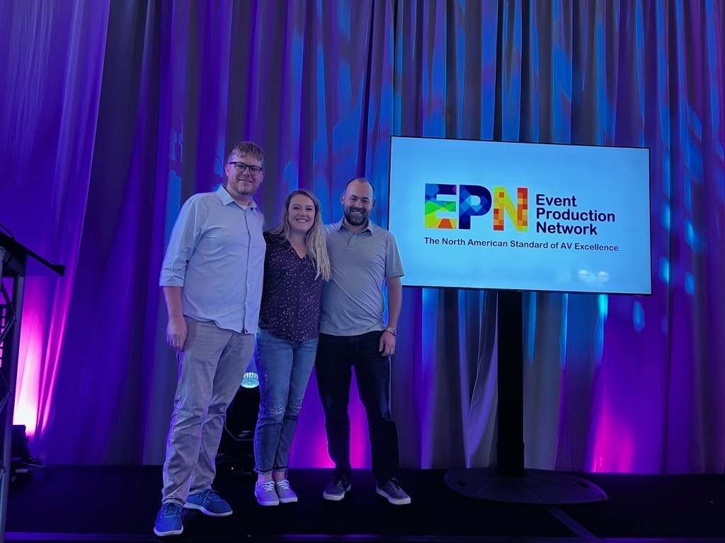 AV Chicago team members standing onstage at the EPN 2022 Symposium